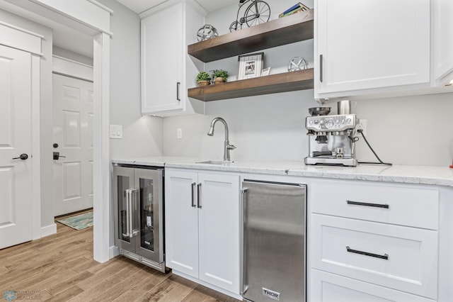 3020 26th Ave S, Fargo, ND 58103 - bar featuring wine cooler, stainless steel fridge, and light wood finished floors