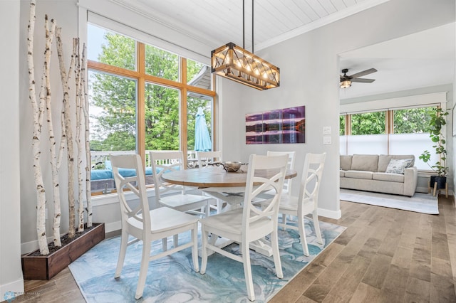 3020 26th Ave S, Fargo, ND 58103 - dining room with crown molding, wood finished floors, a ceiling fan, and a chandelier