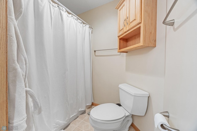 3020 26th Ave S, Fargo, ND 58103 - bathroom featuring baseboards and a shower with curtain