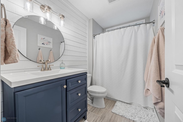 3020 26th Ave S, Fargo, ND 58103 - bathroom with vanity, a shower with shower curtain, and wood walls