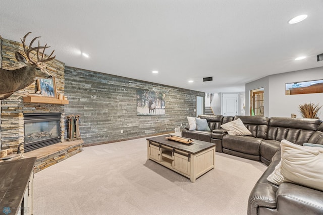 3020 26th Ave S, Fargo, ND 58103 - living room with light colored carpet, a stone fireplace, and recessed lighting