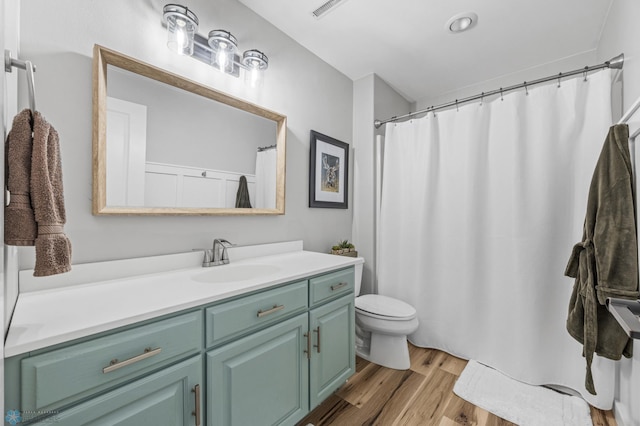 3020 26th Ave S, Fargo, ND 58103 - full bathroom featuring vanity, wood finished floors, and a shower with shower curtain