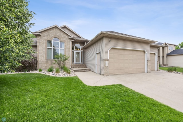 3020 26th Ave S, Fargo, ND 58103 - view of front of home featuring a garage, brick siding, concrete driveway, and a front lawn