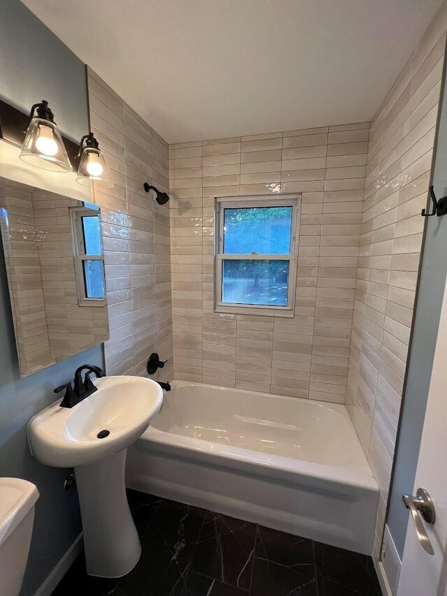 5923 Hodgson Rd, Shoreview, MN 55126 - full bathroom featuring bathing tub / shower combination and marble look tiles