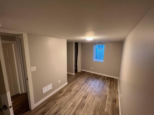 5923 Hodgson Rd, Shoreview, MN 55126 - spare room featuring wood finished floors and baseboards