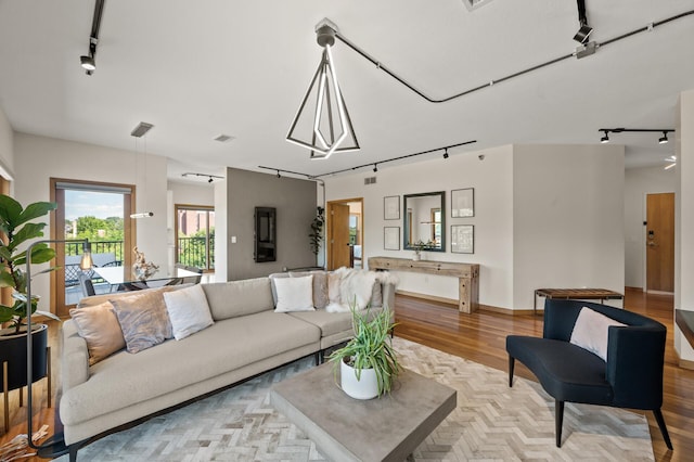 3000 Raleigh Ave Unit 307, Saint Louis Park, MN 55416 - living area featuring rail lighting and wood finished floors