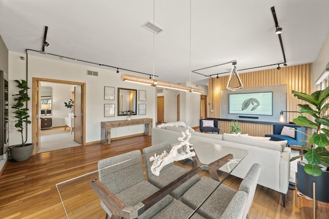 3000 Raleigh Ave Unit 307, Saint Louis Park, MN 55416 - living area with track lighting and wood finished floors