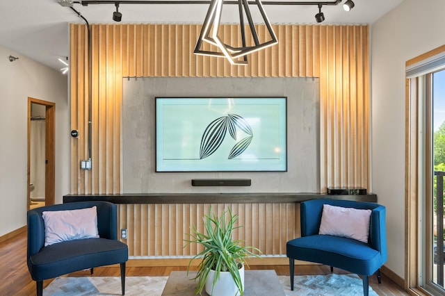 3000 Raleigh Ave Unit 307, Saint Louis Park, MN 55416 - sitting room with track lighting, wood finished floors, and wooden walls