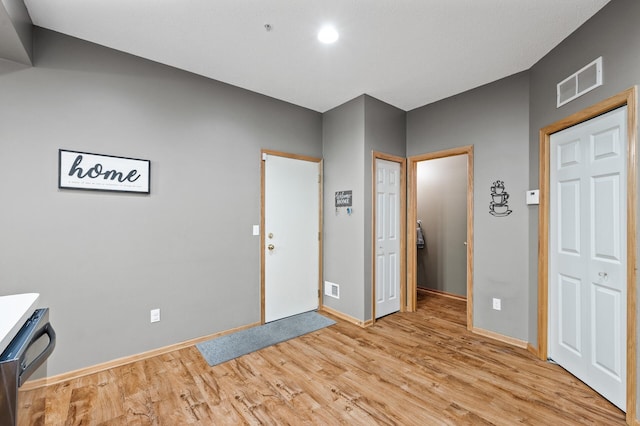 11122 Aberdeen St NE Unit C, Blaine, MN 55449 - foyer with light wood-type flooring and baseboards