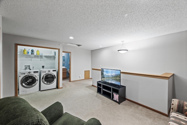 11122 Aberdeen St NE Unit C, Blaine, MN 55449 - living room featuring separate washer and dryer, carpet, recessed lighting, and a textured ceiling