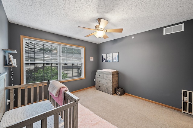 11122 Aberdeen St NE Unit C, Blaine, MN 55449 - bedroom featuring carpet floors, ceiling fan, and a textured ceiling