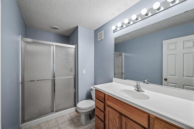 11122 Aberdeen St NE Unit C, Blaine, MN 55449 - bathroom with vanity, a shower stall, tile patterned floors, and a textured ceiling