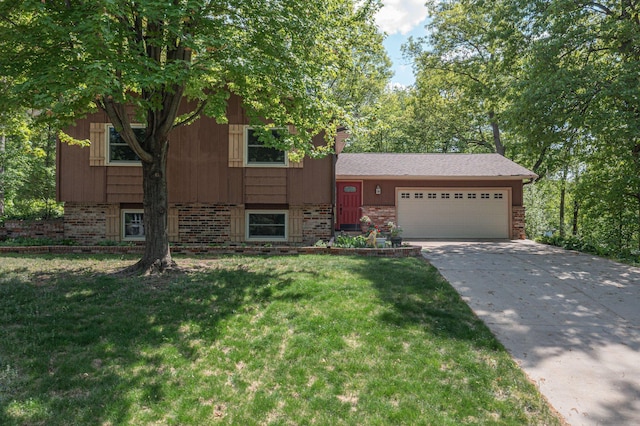 13587 70th Ave N, Maple Grove, MN 55311 - tri-level home featuring brick siding, a garage, driveway, and a front yard