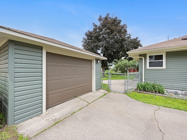 7920 Clinton Ave S, Bloomington, MN 55420 - detached garage with a gate and driveway