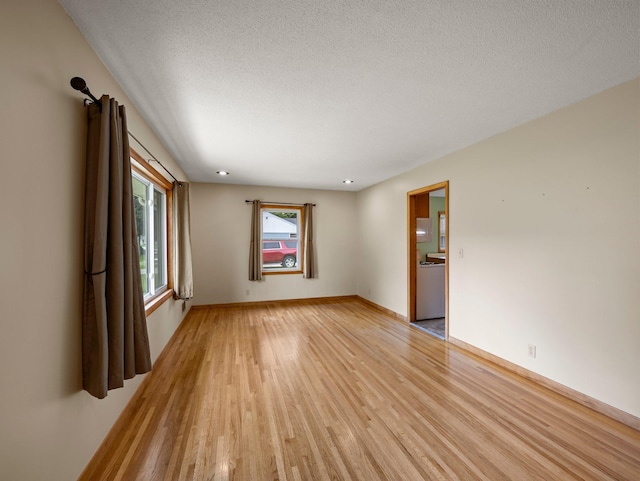 7920 Clinton Ave S, Bloomington, MN 55420 - spare room with light wood-style flooring and a textured ceiling
