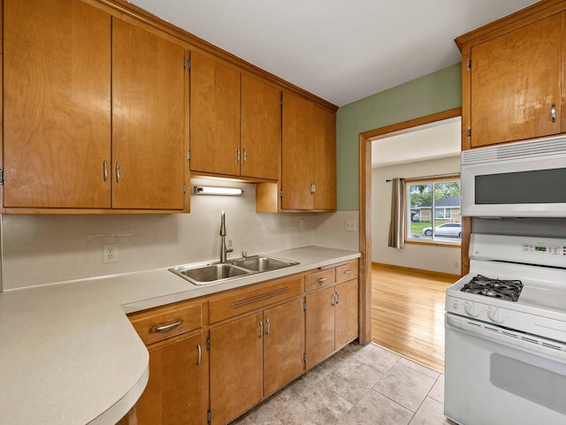 7920 Clinton Ave S, Bloomington, MN 55420 - kitchen with white appliances, light countertops, and brown cabinetry