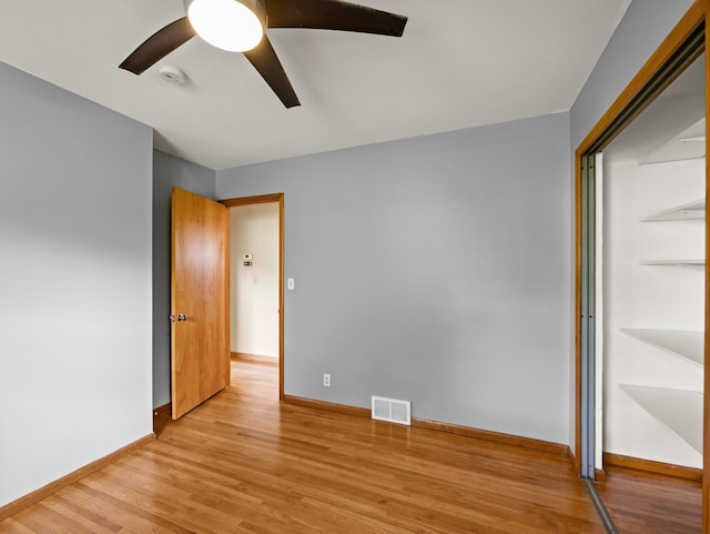 7920 Clinton Ave S, Bloomington, MN 55420 - unfurnished bedroom featuring light wood-type flooring, a closet, and ceiling fan