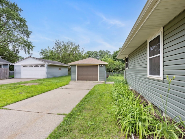 7920 Clinton Ave S, Bloomington, MN 55420 - view of yard with a detached garage and an outbuilding
