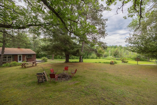 2170 County 5 NW, Hackensack, MN 56452 - view of grassy yard with a fire pit