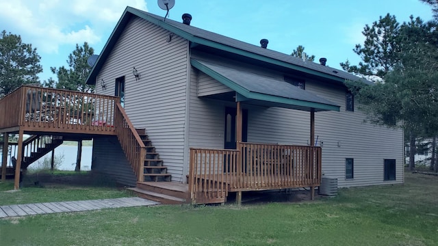 16029 71st Ave NW, Cass Lake, MN 56633 - back of property with a deck, stairs, and a yard