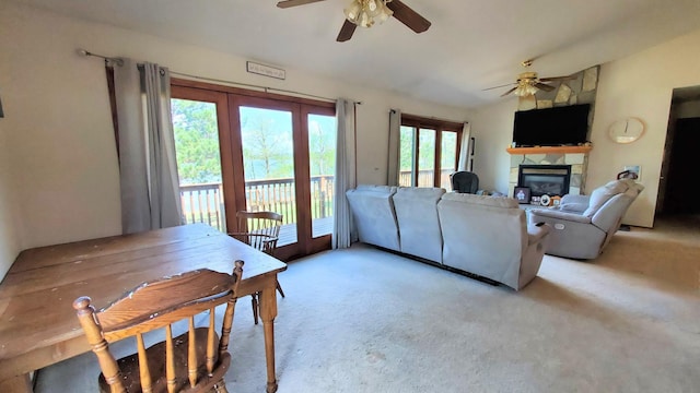 16029 71st Ave NW, Cass Lake, MN 56633 - living area with a ceiling fan, a stone fireplace, and light carpet