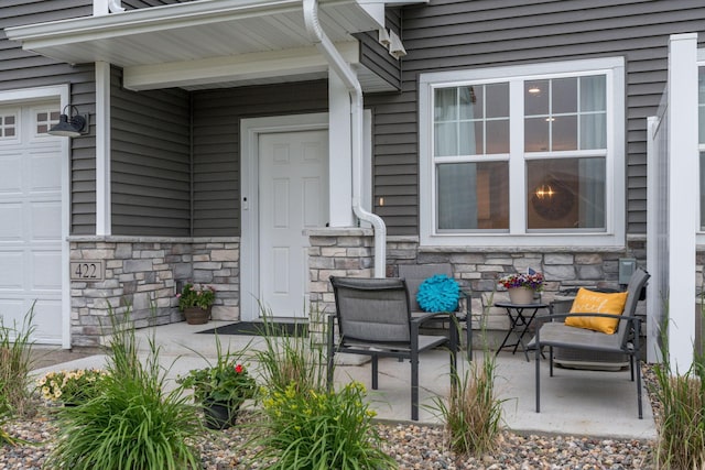 422 Ford St E, Northfield, MN 55057 - view of patio with a garage