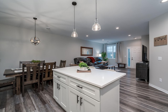 422 Ford St E, Northfield, MN 55057 - kitchen featuring dark wood-style floors, white cabinets, recessed lighting, pendant lighting, and light countertops