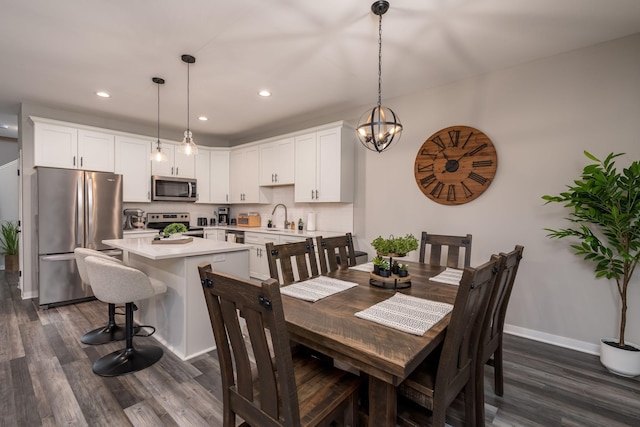 422 Ford St E, Northfield, MN 55057 - dining room with dark wood-style floors, recessed lighting, and a chandelier
