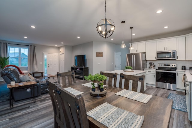 422 Ford St E, Northfield, MN 55057 - dining room with recessed lighting, dark wood-type flooring, and a chandelier