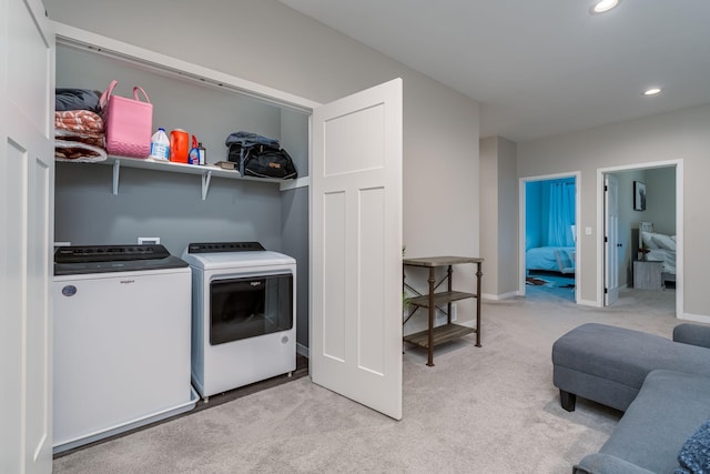 422 Ford St E, Northfield, MN 55057 - laundry area with separate washer and dryer, light colored carpet, and recessed lighting