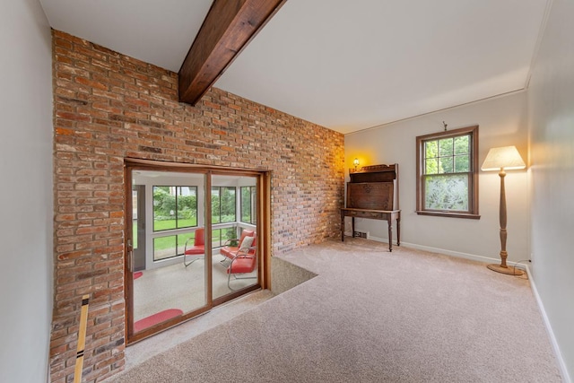 825 5th Ave SW, Faribault, MN 55021 - unfurnished living room featuring carpet floors, brick wall, and beamed ceiling