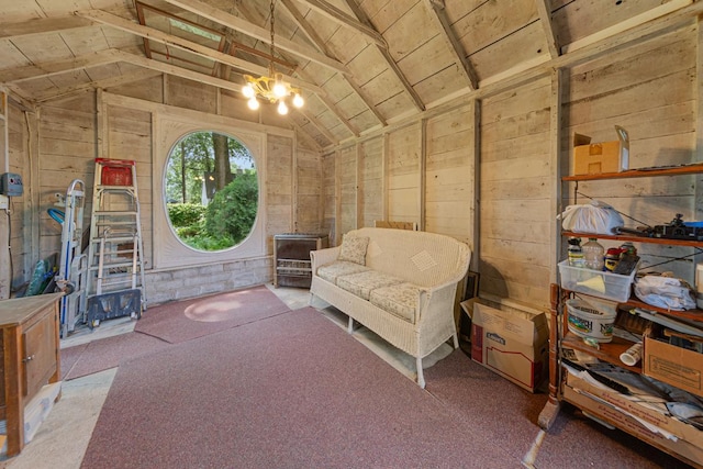 825 5th Ave SW, Faribault, MN 55021 - living area with lofted ceiling, wooden walls, and a chandelier