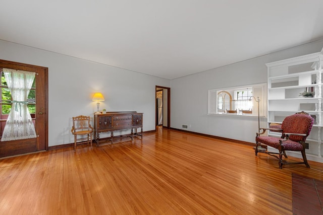 825 5th Ave SW, Faribault, MN 55021 - living area with light wood-style floors and baseboards