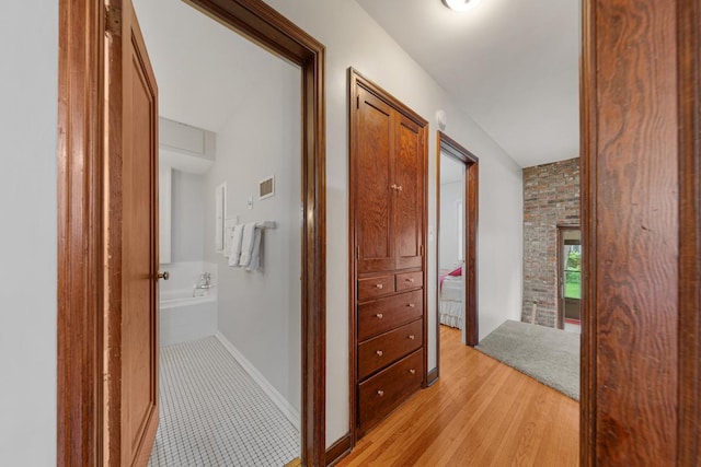 825 5th Ave SW, Faribault, MN 55021 - hallway featuring light wood-style flooring