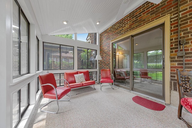 825 5th Ave SW, Faribault, MN 55021 - sunroom / solarium with brick wall, healthy amount of natural light, and carpet floors
