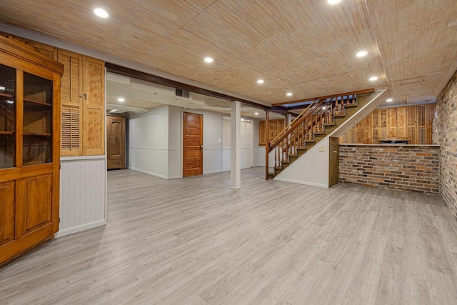 825 5th Ave SW, Faribault, MN 55021 - finished basement with stairs, wood finished floors, brick wall, wood ceiling, and recessed lighting