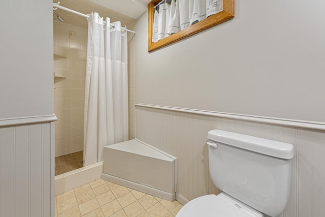 825 5th Ave SW, Faribault, MN 55021 - bathroom with a stall shower, tile patterned flooring, and wainscoting
