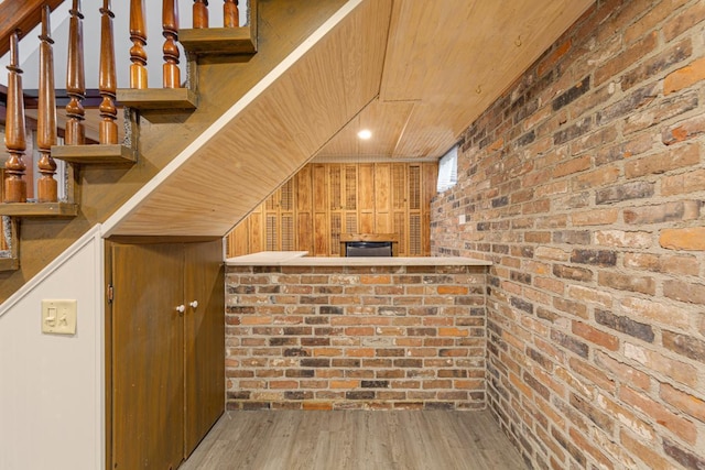 825 5th Ave SW, Faribault, MN 55021 - bar with brick wall, wood finished floors, and wooden ceiling