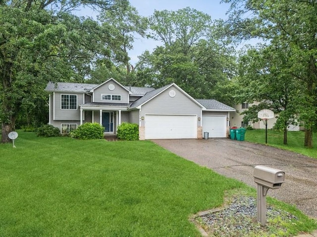 26343 10th St W, Zimmerman, MN 55398 - tri-level home with a garage, a front yard, asphalt driveway, and brick siding