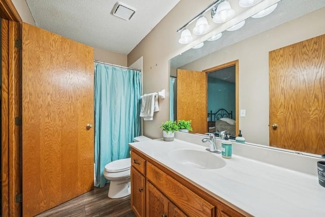 26343 10th St W, Zimmerman, MN 55398 - full bath featuring wood finished floors, vanity, ensuite bath, and curtained shower