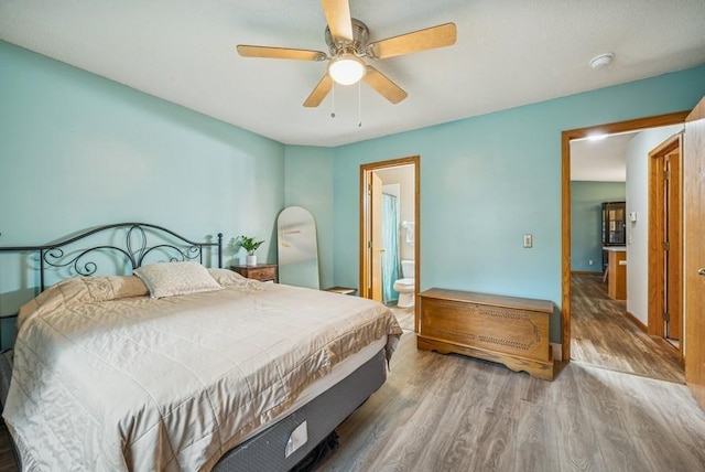 26343 10th St W, Zimmerman, MN 55398 - bedroom featuring wood finished floors, ceiling fan, and connected bathroom