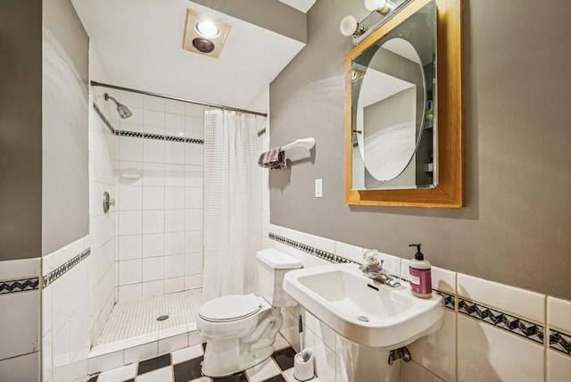 26343 10th St W, Zimmerman, MN 55398 - bathroom with a shower stall, wainscoting, and tile walls