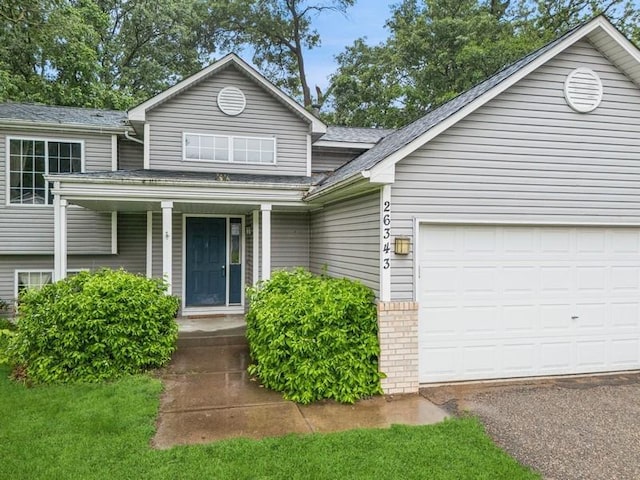 26343 10th St W, Zimmerman, MN 55398 - view of front facade featuring an attached garage, brick siding, and a shingled roof