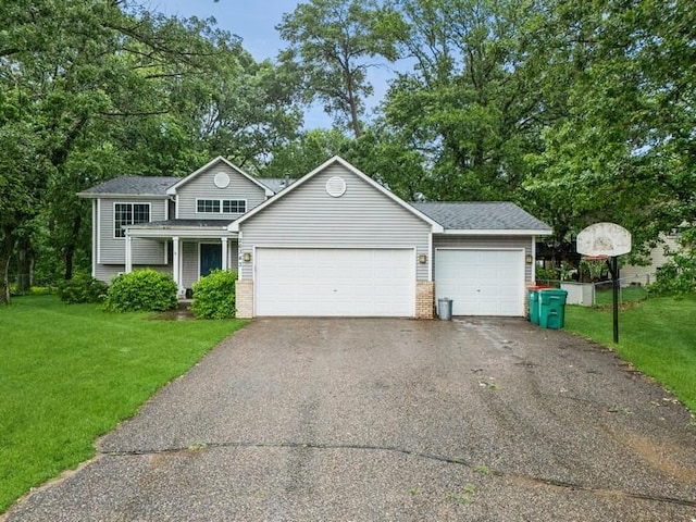 26343 10th St W, Zimmerman, MN 55398 - view of front of house with driveway, a front yard, a garage, and brick siding
