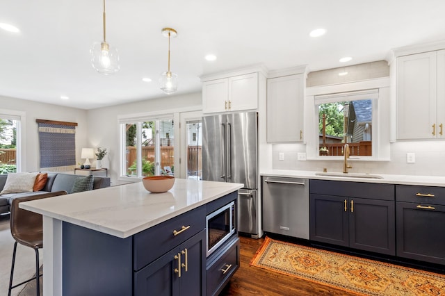 4810 42nd St, Saint Louis Park, MN 55416 - kitchen featuring stainless steel appliances, healthy amount of natural light, white cabinets, open floor plan, and recessed lighting
