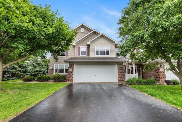 20354 Kensfield Trl Unit 1403, Lakeville, MN 55044 - traditional-style home featuring asphalt driveway, brick siding, a front yard, and an attached garage