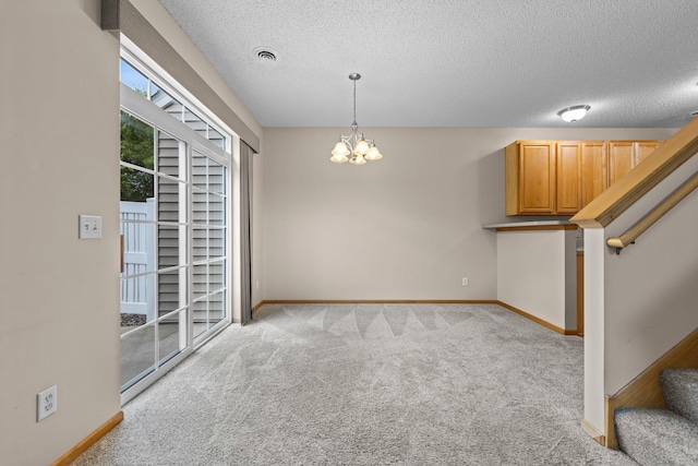 20354 Kensfield Trl Unit 1403, Lakeville, MN 55044 - unfurnished dining area with stairs, carpet flooring, a chandelier, and a textured ceiling
