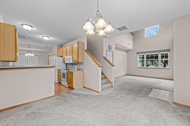 20354 Kensfield Trl Unit 1403, Lakeville, MN 55044 - kitchen with white appliances, a chandelier, and light colored carpet