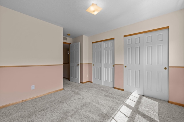 20354 Kensfield Trl Unit 1403, Lakeville, MN 55044 - unfurnished bedroom with two closets and carpet