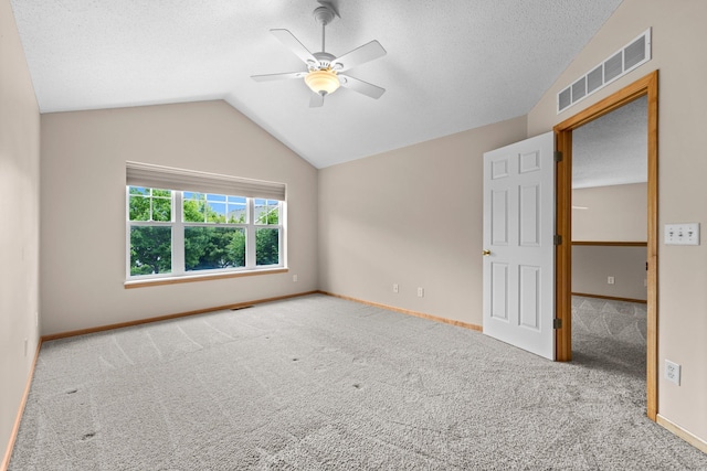 20354 Kensfield Trl Unit 1403, Lakeville, MN 55044 - carpeted empty room featuring a ceiling fan, lofted ceiling, and a textured ceiling